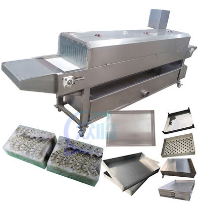 Separate tray machine Fish and shrimp frozen tray isolated in seafood processing factory